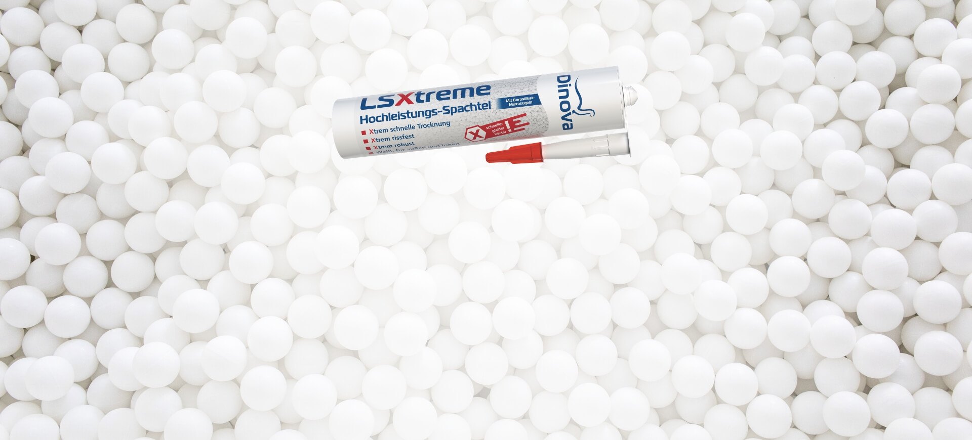 LSXtreme Packshot vom Hochleistungs-Spachtel LSXtreme auf einem weißen Hintergrund mit weißen Mikrokugeln